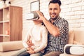 Man and Girl in Mask Virtual Reality at Home. Royalty Free Stock Photo