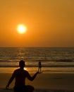 Man and girl silhouettes of the sea