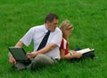 Man and girl sitting in the grass Royalty Free Stock Photo