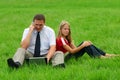 Man and girl sitting in the grass Royalty Free Stock Photo