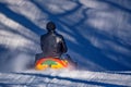 Man with daughter sledding down a snowy hill Royalty Free Stock Photo