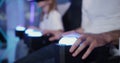 man and girl in virtual reality glasses on 5D attraction, press control buttons