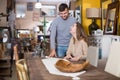 Man with girlfriend admiring vintage table