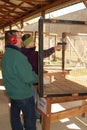 Man gives shooting tips to young woman at shooting range Royalty Free Stock Photo