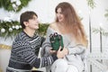 A man gives a woman a Christmas present Royalty Free Stock Photo