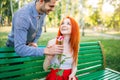 Man gives woman flower, romantic date