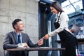 Man giving bank card to female waiter Royalty Free Stock Photo