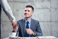 Man giving bank card to female waiter Royalty Free Stock Photo