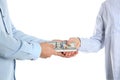 Man giving bribe money to woman on white background, closeup of hands Royalty Free Stock Photo