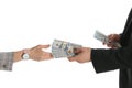Man giving bribe money to woman on white background, closeup of hands Royalty Free Stock Photo