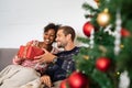 Man giving christmas present to woman Royalty Free Stock Photo