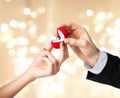Man giving diamond ring to woman on valentines day Royalty Free Stock Photo