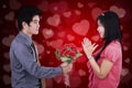 Man giving flower to his girlfriend Royalty Free Stock Photo