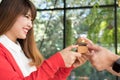 man giving gift box with engagement ring to woman. boyfriend making marriage proposal to girlfriend. Romance, birthday, valentine Royalty Free Stock Photo