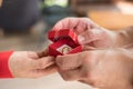 man giving gift box with engagement ring to woman. boyfriend making marriage proposal to girlfriend. Romance, birthday, valentine Royalty Free Stock Photo