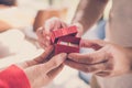 man giving gift box with engagement ring to woman. boyfriend making marriage proposal to girlfriend. Romance, birthday, valentine Royalty Free Stock Photo