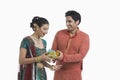 Man giving gift to his wife on Diwali Royalty Free Stock Photo