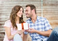 Man giving a gift to woman Royalty Free Stock Photo