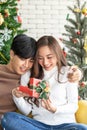 Man giving girl christmas present Royalty Free Stock Photo