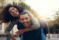 Man giving his girlfriend piggyback ride Royalty Free Stock Photo