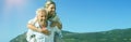 Man giving his laughing wife a piggy back at the beach Royalty Free Stock Photo