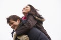 Man Giving His Wife Piggy Back Ride Royalty Free Stock Photo