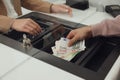 Man giving money to cashier in bank, closeup. Currency exchange