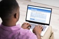 Man Giving Online Survey On Laptop Royalty Free Stock Photo