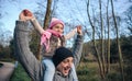 Man giving piggyback ride to happy girl outdoors Royalty Free Stock Photo
