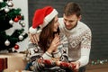 Man giving present to his woman. joyful cozy moments in winter h