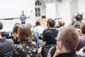 Man giving presentation in lecture hall at university. Royalty Free Stock Photo