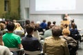 Man giving presentation in lecture hall at university. Royalty Free Stock Photo