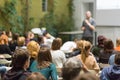 Man giving presentation in lecture hall at university. Royalty Free Stock Photo