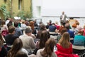 Man giving presentation in lecture hall at university.