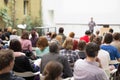 Man giving presentation in lecture hall at university. Royalty Free Stock Photo