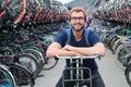 Man giving smiling at bicycle parking lot Royalty Free Stock Photo