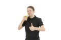 Man giving thumbs up for the delicious green vegetable smoothie