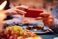 Man giving wife gift box