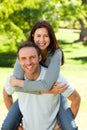 Man giving wife a piggyback