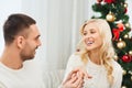 Man giving woman engagement ring for christmas Royalty Free Stock Photo