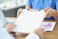 Man giving woman resume for employment in office closeup Royalty Free Stock Photo