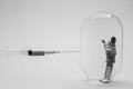 A man in a glass flask symbolizing immunity is trying to refuse vaccination against coronavirus