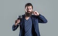 Man with a glass of red wine in his hands. Beard man, bearded, sommelier tasting red wine. Sommelier, degustator with Royalty Free Stock Photo