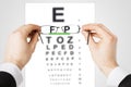 Man with glasses and eye chart Royalty Free Stock Photo