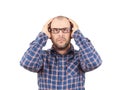 Man with glasses holding his head with his hands. Royalty Free Stock Photo
