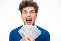 Man in glasses with money shouting