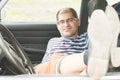 Man with glasses resting in the car Royalty Free Stock Photo