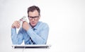 Man in glasses, shirt and tie at a computer with a large bundle of money. The concept of earning in the Internet. Right is empty s Royalty Free Stock Photo