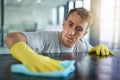 Man with gloves, office cleaning service and janitor dusting dirt for health and hygiene in workplace. Professional Royalty Free Stock Photo