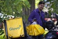 Man with Glovo bags working at food delivery service